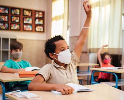 Kids in the classroom wearing masks Kids in the classroom wearing masks
